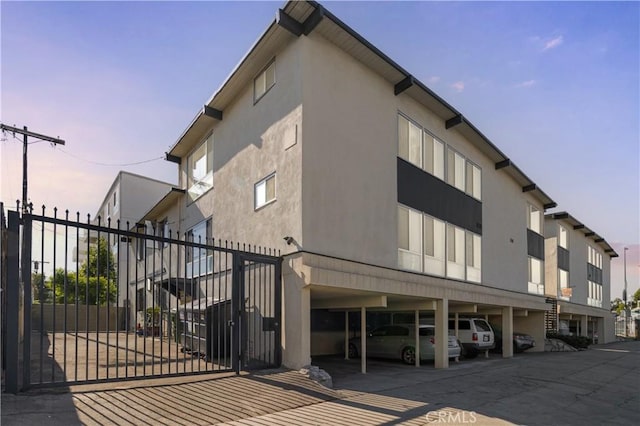 exterior space with a carport