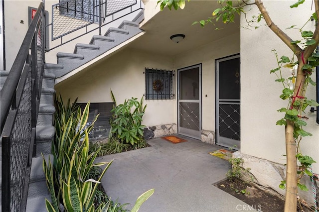 doorway to property featuring a patio area