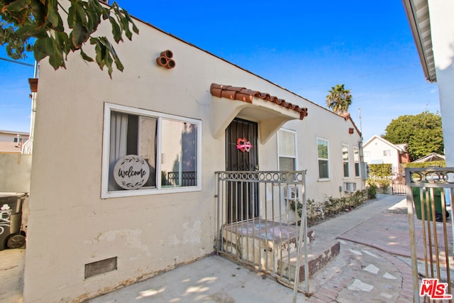 view of front of house with a patio area