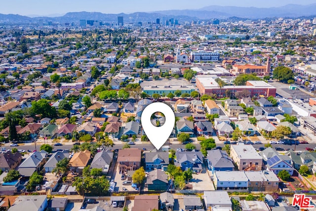 drone / aerial view featuring a mountain view