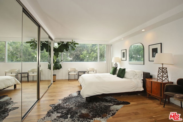 bedroom with light wood-type flooring