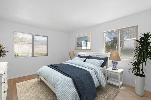 bedroom with light wood-type flooring