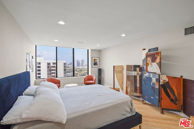 bedroom with light hardwood / wood-style flooring