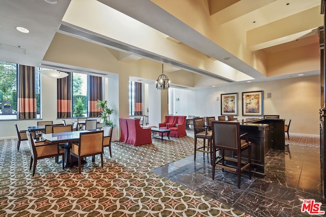 dining area with an inviting chandelier