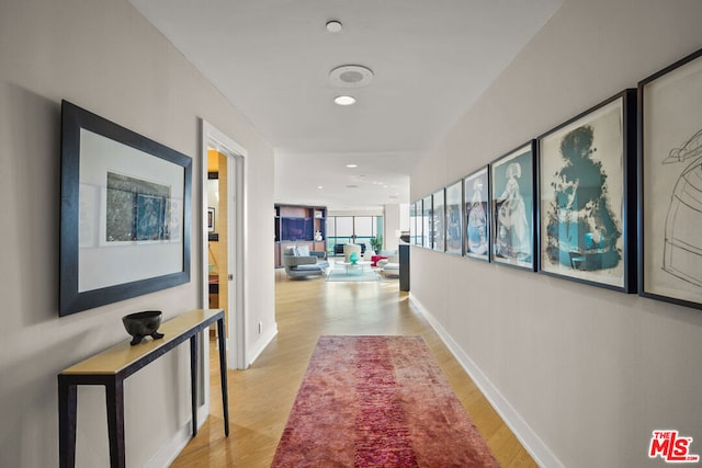 hallway with light wood-type flooring