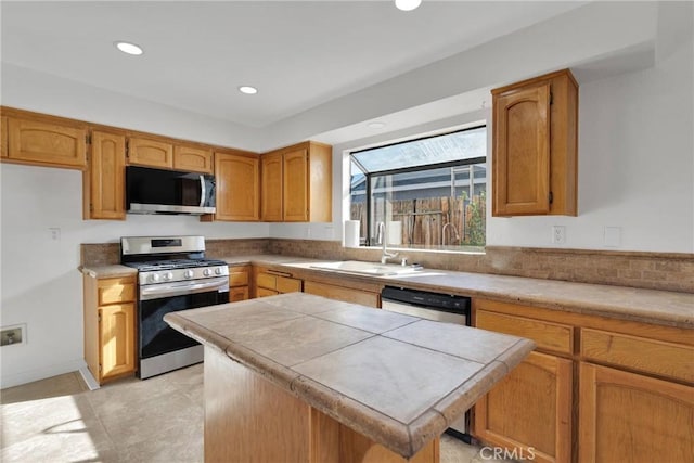 kitchen with sink and appliances with stainless steel finishes