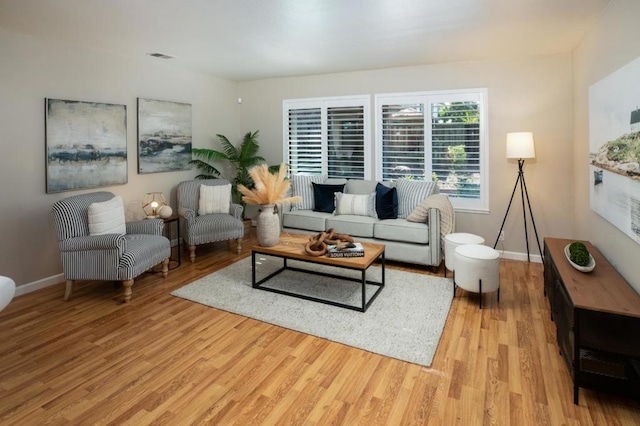 living room with light hardwood / wood-style flooring