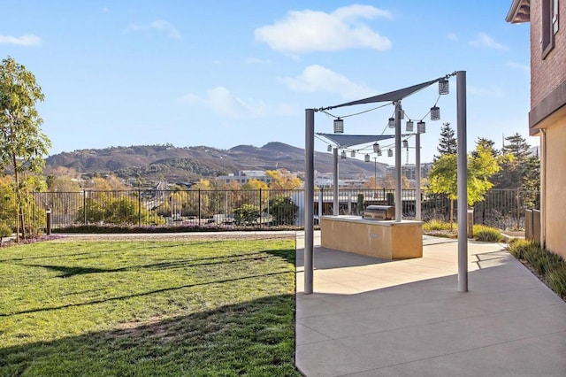 exterior space featuring a patio, area for grilling, and a mountain view