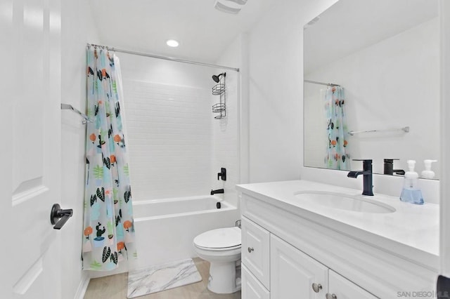 full bathroom featuring wood-type flooring, shower / tub combo, vanity, and toilet