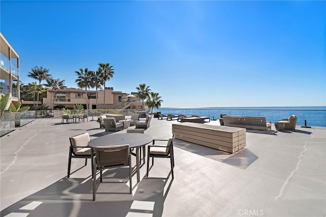 view of patio with a water view