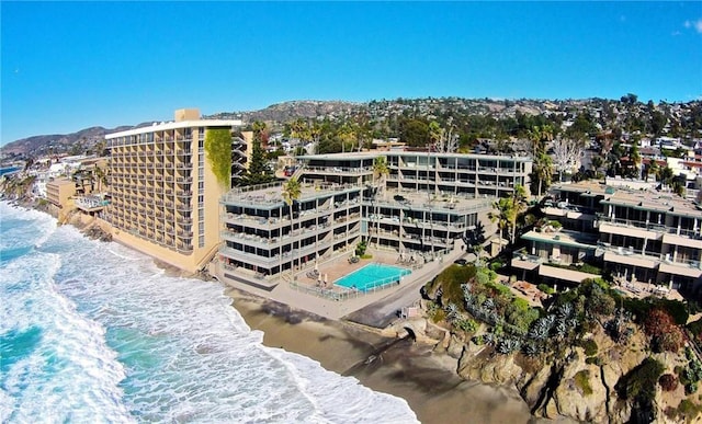 birds eye view of property featuring a water view and a view of the beach