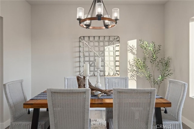 dining room featuring hardwood / wood-style floors and an inviting chandelier