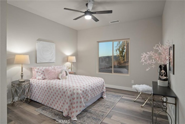 bedroom with hardwood / wood-style flooring and ceiling fan