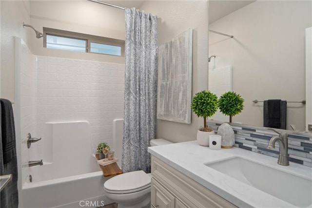 full bathroom featuring toilet, backsplash, vanity, and shower / bathtub combination with curtain