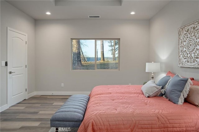 bedroom with hardwood / wood-style flooring