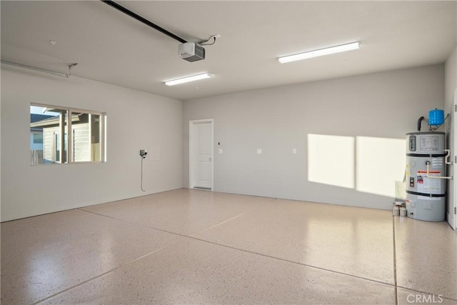 garage featuring a garage door opener and strapped water heater