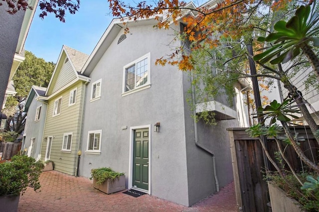 rear view of property featuring a patio area