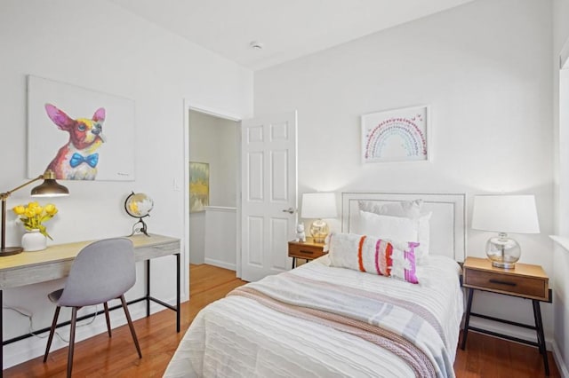 bedroom with hardwood / wood-style flooring