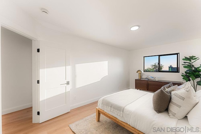 bedroom with light wood-type flooring