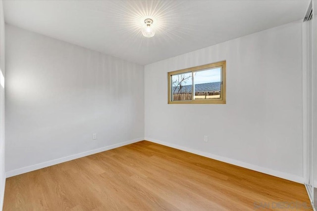 unfurnished room featuring light hardwood / wood-style floors