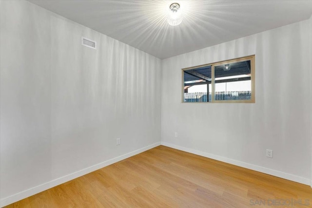 empty room featuring wood-type flooring