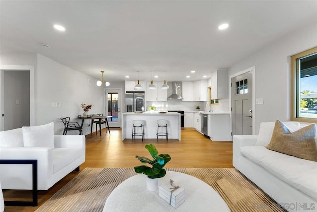 living room with light hardwood / wood-style flooring