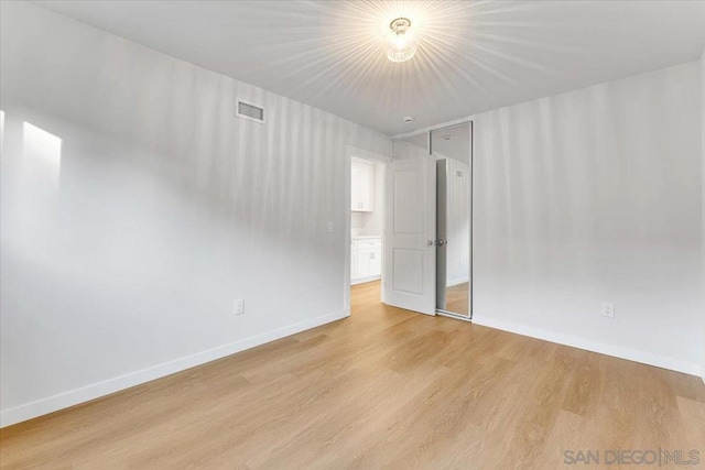 unfurnished room featuring light hardwood / wood-style flooring