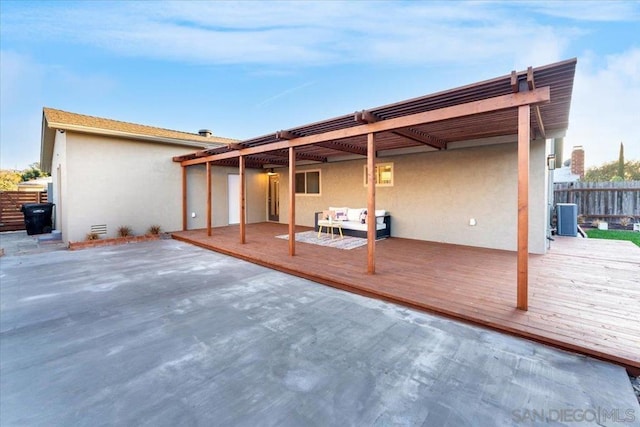 back of house with a patio, central AC, an outdoor living space, and a wooden deck