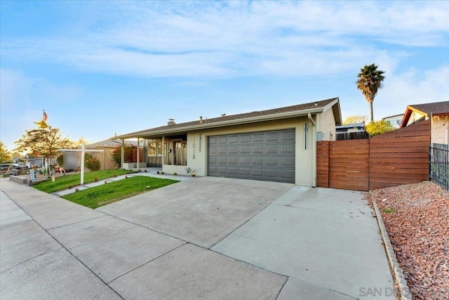 ranch-style home with a front yard and a garage