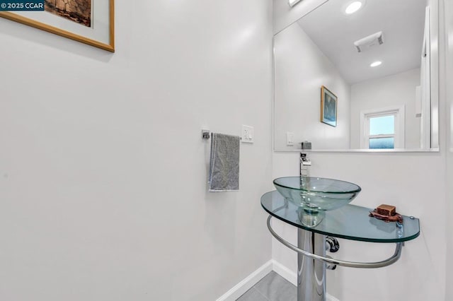 bathroom with sink and tile patterned flooring