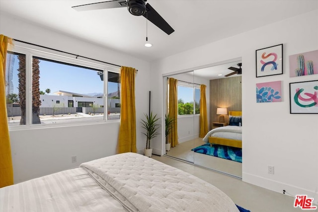 bedroom featuring ceiling fan and a closet