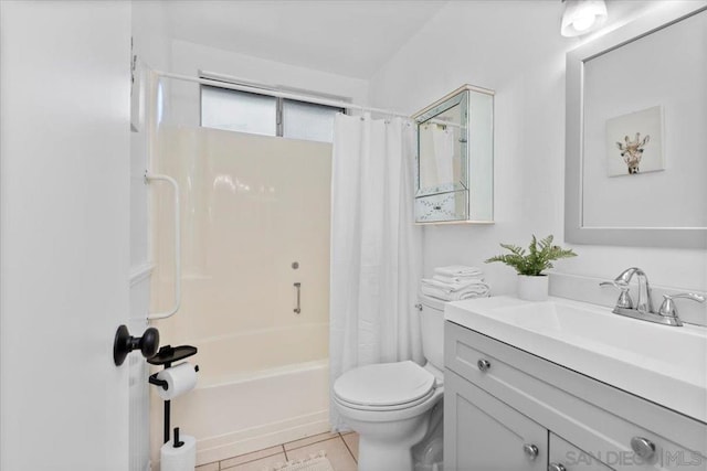 full bathroom featuring shower / bathtub combination with curtain, vanity, tile patterned floors, and toilet