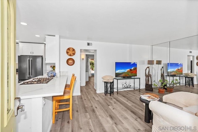 living room with light hardwood / wood-style floors