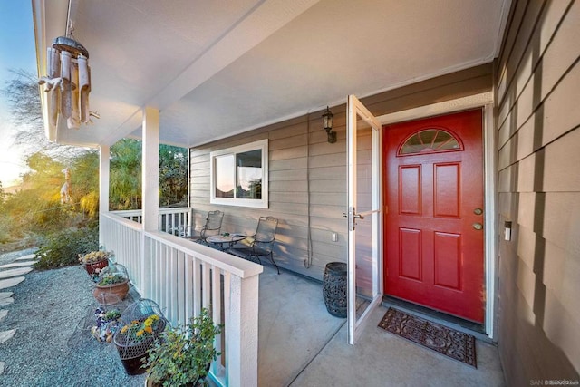 doorway to property featuring a porch