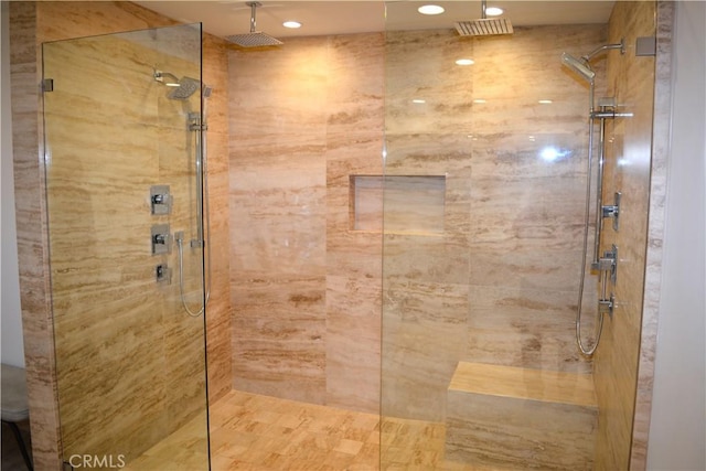 bathroom with a tile shower