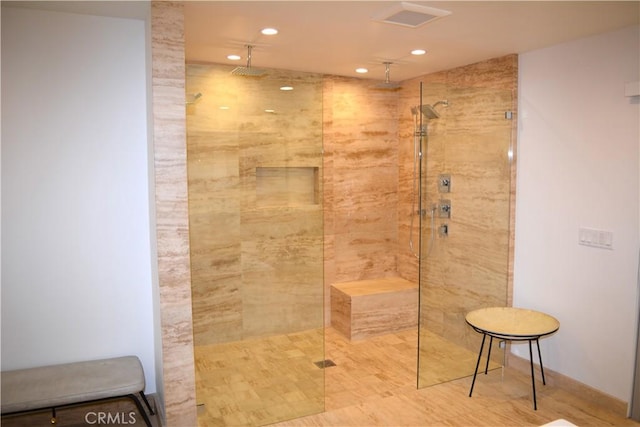 bathroom featuring tiled shower