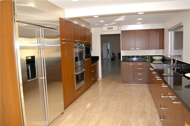 kitchen with sink and built in appliances