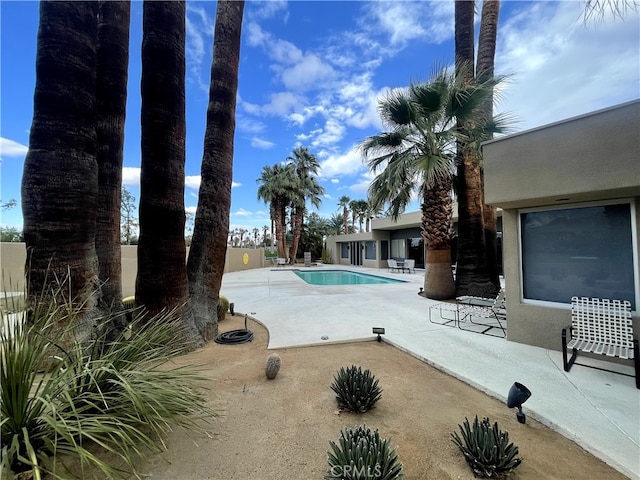 view of swimming pool featuring a patio