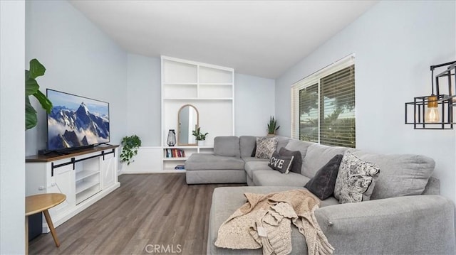 living room with lofted ceiling and hardwood / wood-style floors