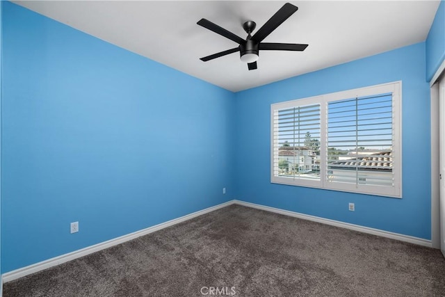 spare room featuring carpet flooring and ceiling fan