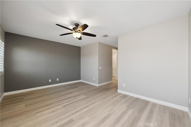 unfurnished room featuring ceiling fan and light wood-type flooring