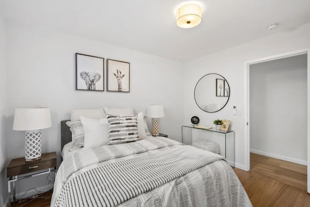 bedroom with hardwood / wood-style floors