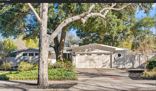 single story home with a garage