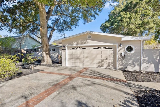 view of front facade with a garage and an outdoor structure