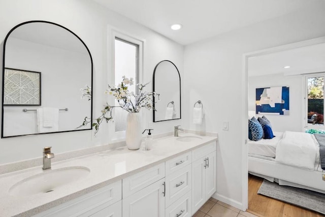 bathroom featuring tile patterned flooring and vanity