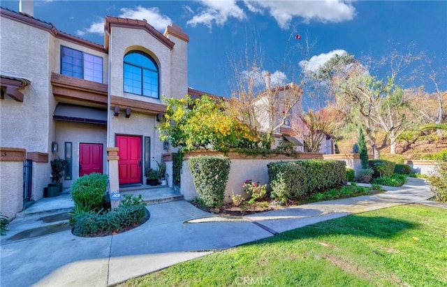 doorway to property with a yard