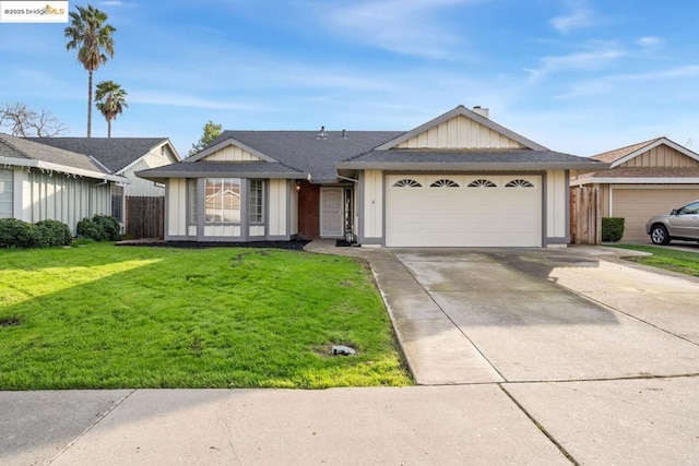 ranch-style home featuring a front yard and a garage