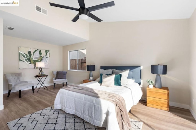 bedroom with ceiling fan and hardwood / wood-style flooring