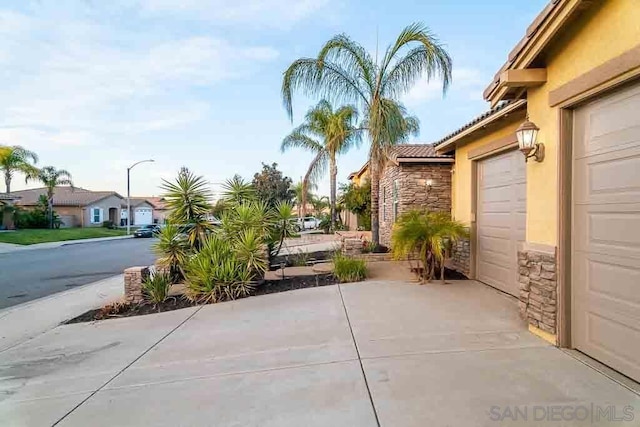 view of patio featuring a garage