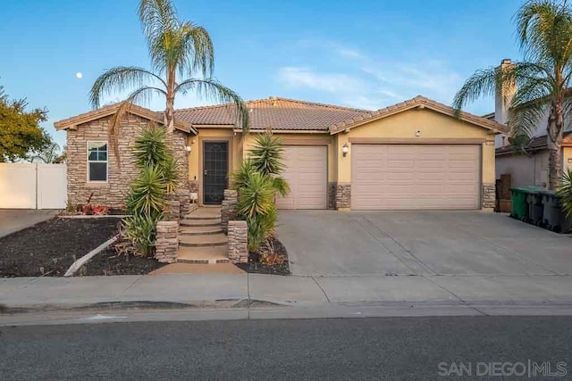 view of front of property with a garage